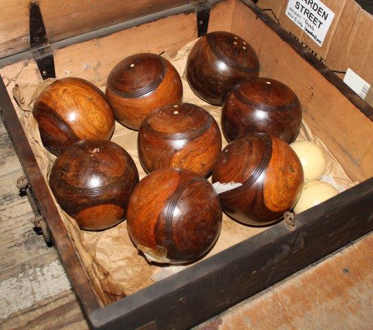 Set of wooden lawn bowls